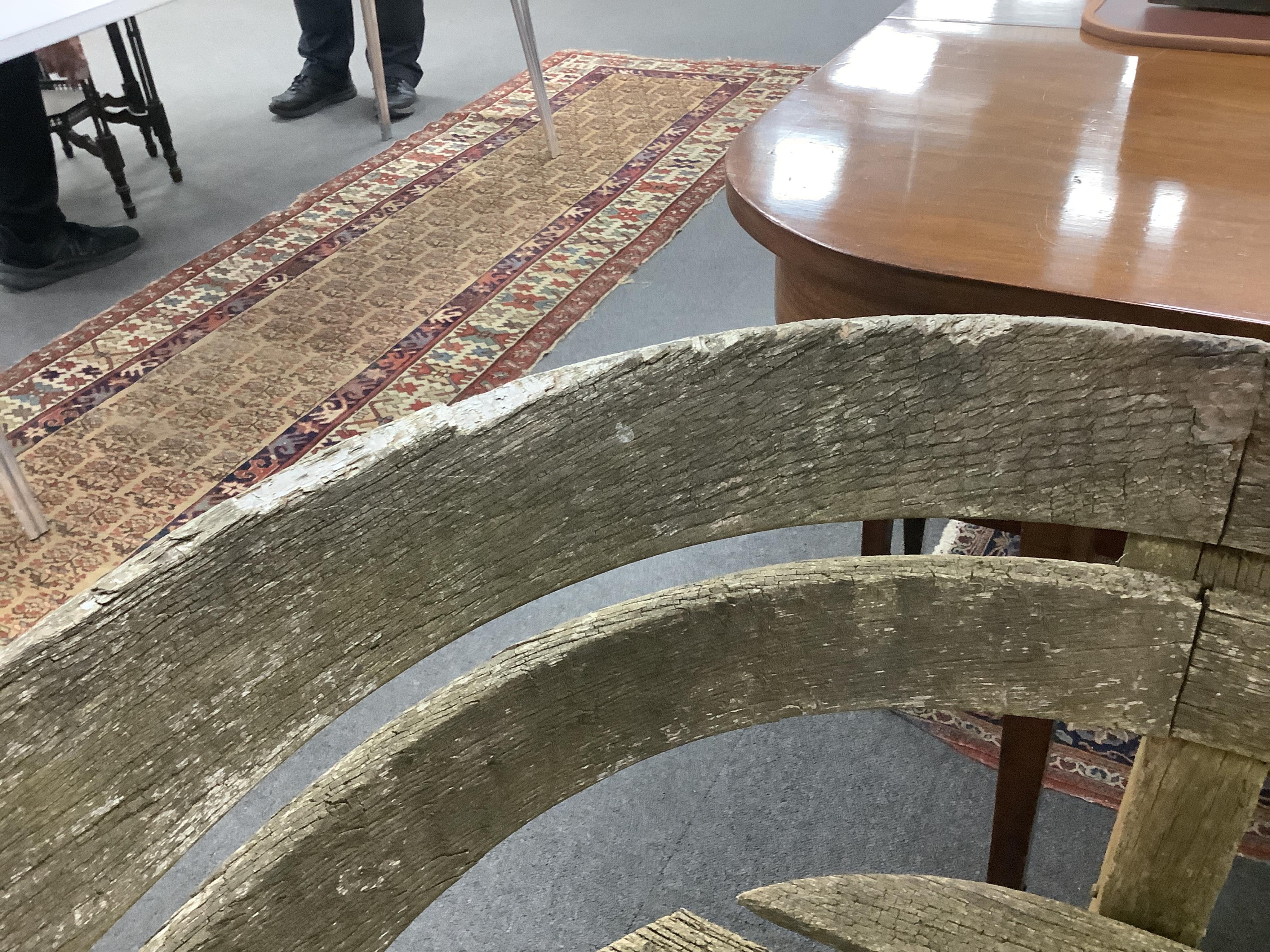 A Gaze Burvill steam bent oak “Court” garden bench, width 146cm, depth 58cm, height 79cm. Condition - fair